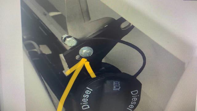 <p>Drill a new hole, and mount filler neck to the bracket like this.</p>
