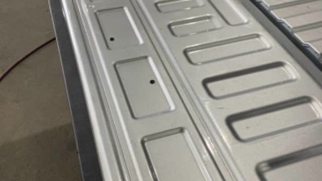 <p>Lower tailgate, remove inner panel using T15 bit</p>