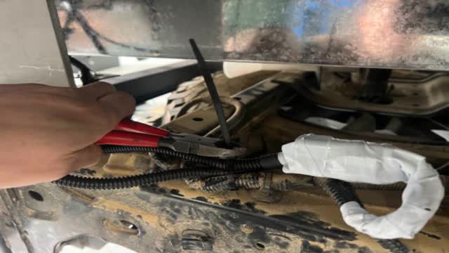 <p>Zip tie harness neatly and cut off zip tie tails</p>