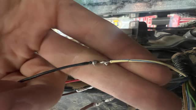<p>The thinner Black (it will be twisted up with the thinner brown wire) to the yellow with blue stripe</p>