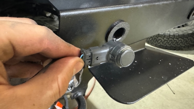 <p>Fit 3-D printed sensor brackets to The tail light housing push the factory sensors in from the backside until they click into position</p>
