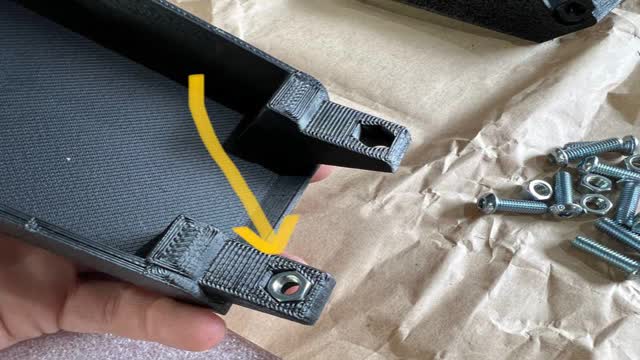 <p>Insert nuts into the 3D printed brackets</p>