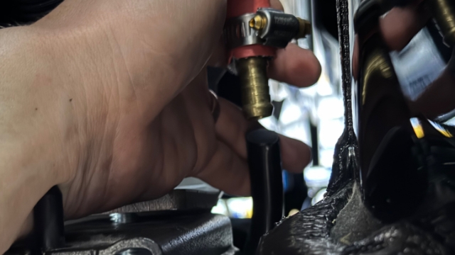 <p>Connect the fuel breather</p>
