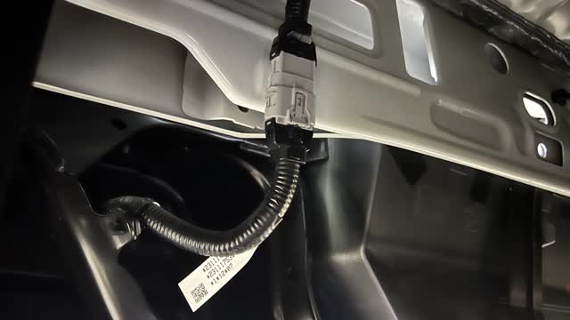 <p>From under the vehicle, unplug the wiring to the bumper.</p>