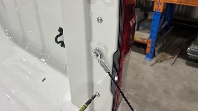 <p>With the tailgate open, remove the 2 x Phillips Head Screws holding the tail lights</p>
