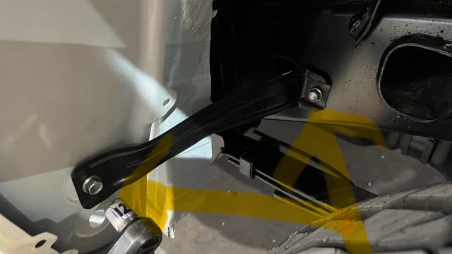 <p>In front of the wheel, identify this body bracket.12mm socket. Qty 2.</p>