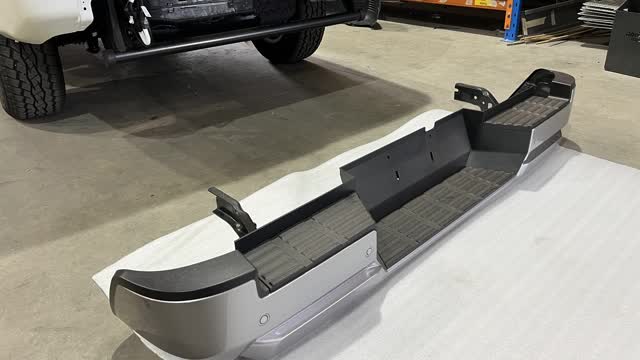 <p>Lower the Rear Bumper onto foam or a blanket.</p>
