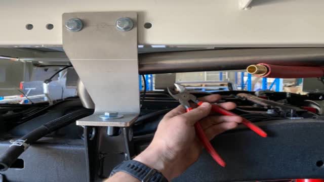 <p>Cut zip ties which hold the stainless pipe up during transport.</p>
<p>Cut them, then the stainless pipe will drop down near the tank</p>