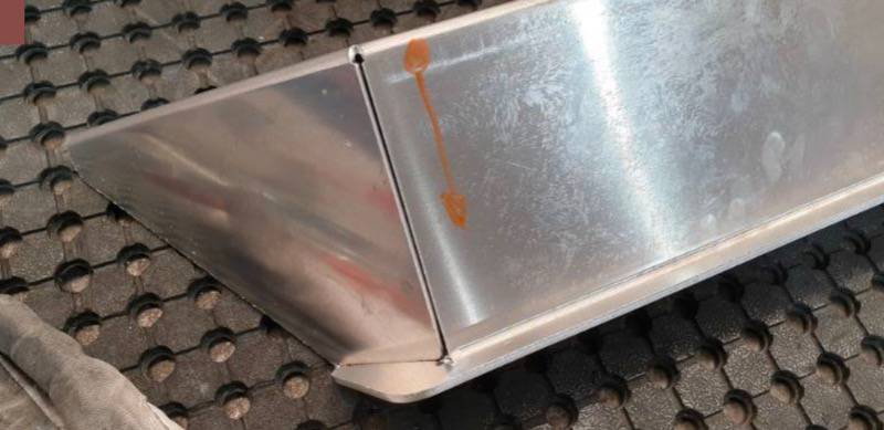 <p>Flip part over, and anticipate weld direction shown.</p>
