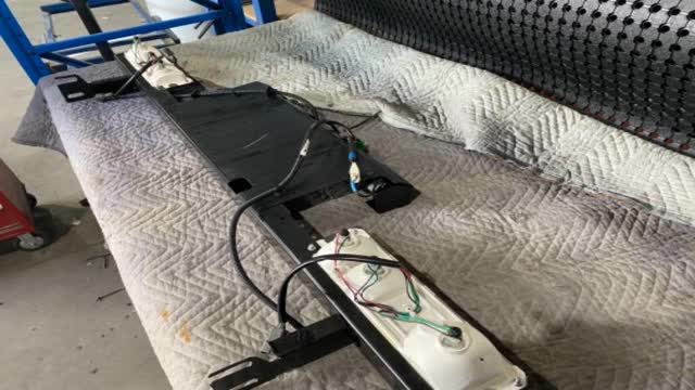<p>Lay light assembly on a workbench.</p>