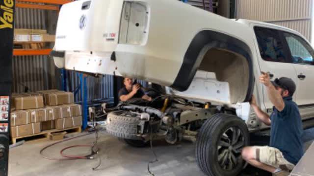 <p>Lift tub the rest of the way ensuring you do not hit the cab or wheels will need 2 people each side and one on forklift (3 people in total)</p>