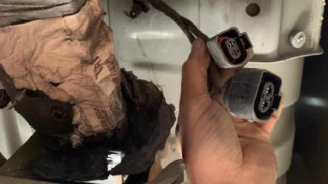 <p>Cut zip tie holding the harness to tub</p>