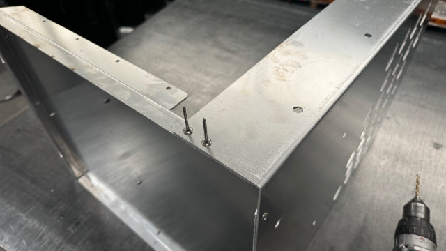 <p>Easist to lay it on its side and rivet it.</p>