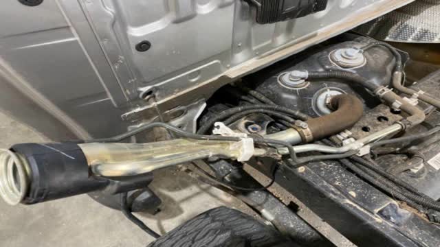 <p>Original filler looks like this, remove it - it is not reused.</p>
<p>•10mm for main hose clamp
• Pliers for breather clamp</p>