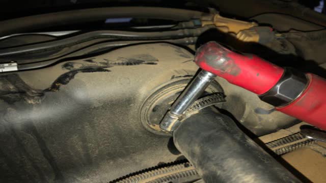 <p>Refit trimmed fuel hose to tank, tighten clamp.</p>
<p>The “chopped” end faces out. (Not against the tank)</p>