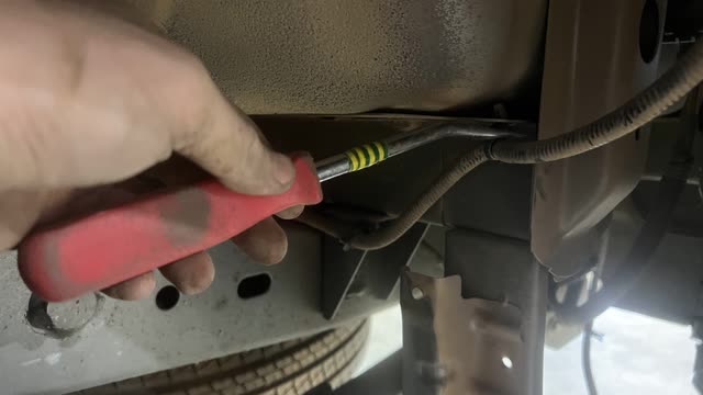 <p>Unclip the wiring from the tub</p>