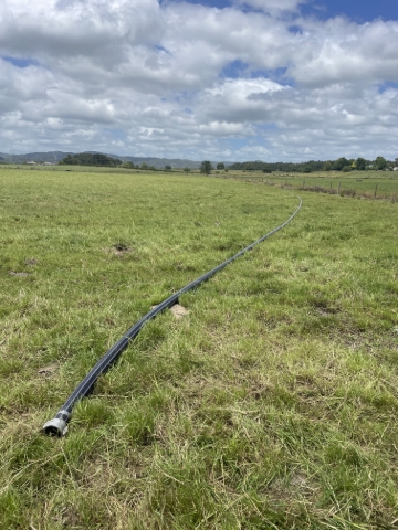 <p>Left over pipe placed on the opposite side of paddock out of the way to be used later on when irrigator is turned around and on another run</p>