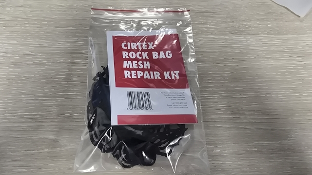 <p>Place the string the mesh and the label with the barcode facing out in the ziplock bag.</p>