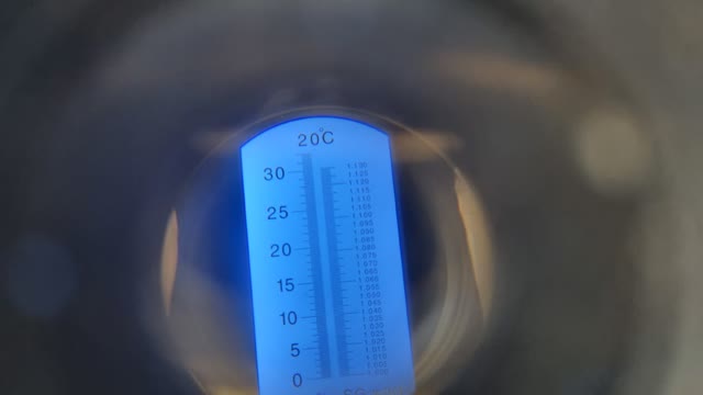 <p>Look for where the line where white changes to blue in the lens, and look at the scale of numbers on the left hand side. If the milk measures above 22 then milk the cow into a test bucket.
If the.milk is below 22 then the cow gets.milked into the calf milk vat</p>