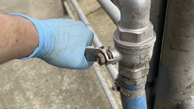 <p>Switch off water at hose source. Check clamp for leaks, tighten if nessesary. Open hose nozzle to release excess water.</p>