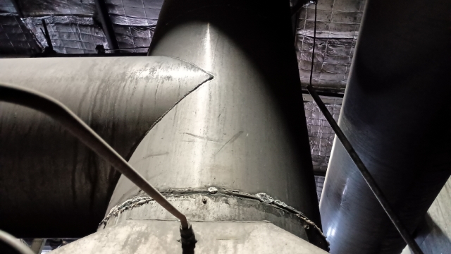 <p>Raise stack with crane and remove cross members. Carefully lower stack into position and secure with teks.</p>