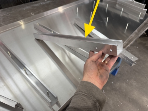 <p>Identify the end wall extrusions. </p><p><br></p><p>The end will 2 holes, goes to the top of canopy</p>