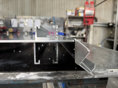 <p>Notice that the outside rivets are back-to-back. Same rivet goes through both</p>