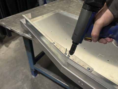 <p>Rivet together. </p><p><br></p><p>Repeat for both end walls</p>
