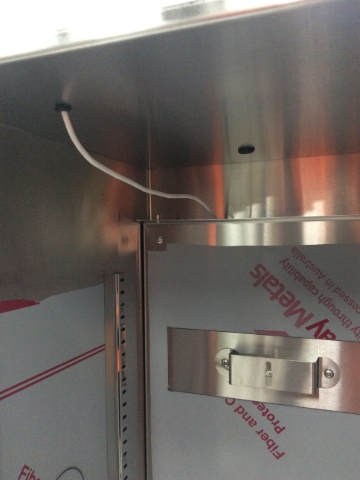 <ol><li>Fit the rubber grommets to the top of the incubator liner.</li><li>Before fitting the back panel, push the sensor cable through the small grommet at the front. Leaving enough wire slack to mount the back panel.</li><li>Attach the back panel using screws (<strong>Part 21208A)</strong></li></ol>