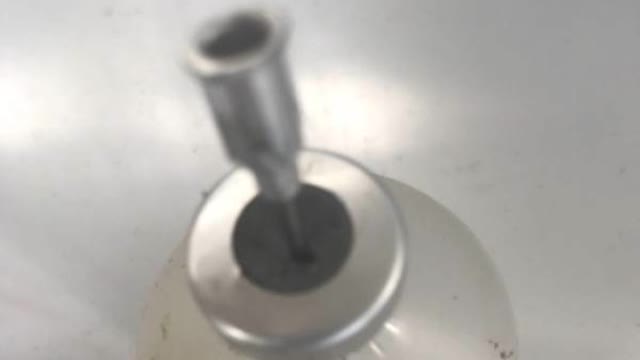 <p>Pierce the top of bottles before loading them on repro guns.
Otherwise you run the risk of pushing the bung into the bottle when attaching it.</p>
