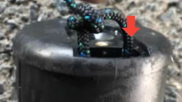 <p>Knot the end and put the residual cord back through the other side hole.</p>