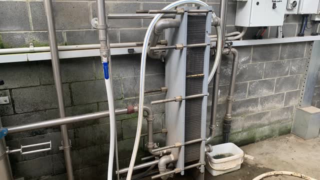 <p>It then goes through a <strong>plate cooler</strong> where water cools the milk.</p>