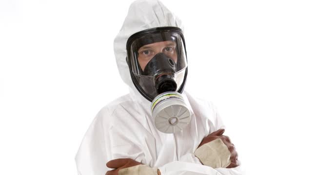 <p>Put on the mask and overalls and make sure they fit properly.</p>

