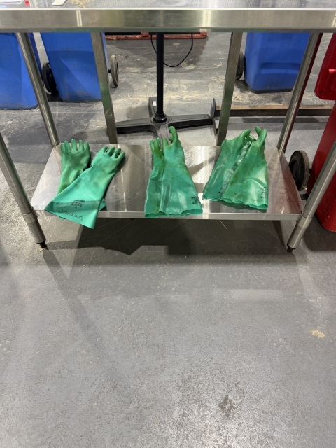 <p><strong>Chemical Gloves Location</strong></p><p></p><ul><li><p>Below the main desk is where the chemical gloves are kept, put these on now.</p></li></ul><p></p><p></p><p></p>