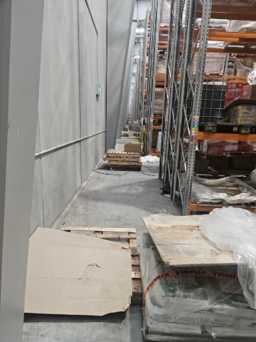 <p>Walkways are being used for storing pallets and goods</p>