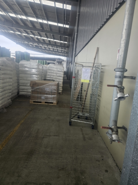 <p>The walkway in the yard is blocked partially . </p>