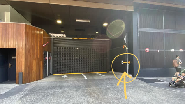 <p>Swipe your fob at the sensor on the right, and the doors will open. Keep driving down.</p>