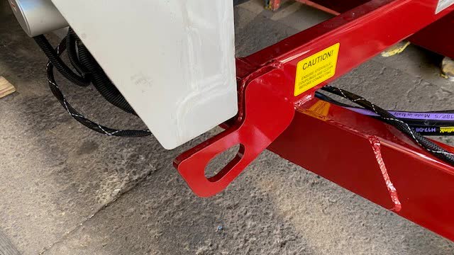 <p>Feed the ISOBUS (black & white) loom under the chassis cross member then over the chassis rail out to the electronic enclosure on the right hand side as pictured.</p>
