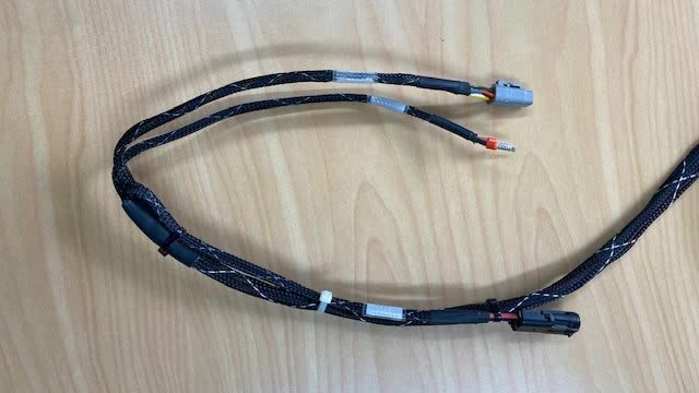 <p>Cable tie the other power lead back on the loom as pictured.</p>