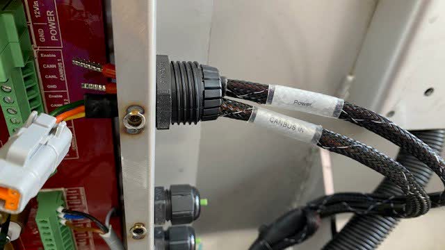 <p>Feed the (Power Cable) and (CANBUS IN Cable) into the top gland as pictured. the CANBUS plug will be a tight fit but will go through the gland.</p>