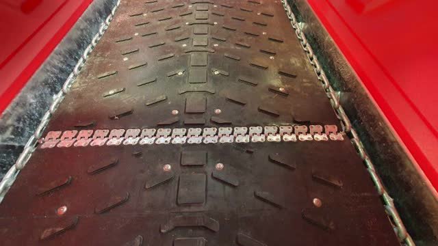 <p>Check slats on either side of joiner. If not riveted, lay slat in position and use as jig for drilling hole through belt. DO NOT RIVET UNTIL BELT IS JOINED.</p>