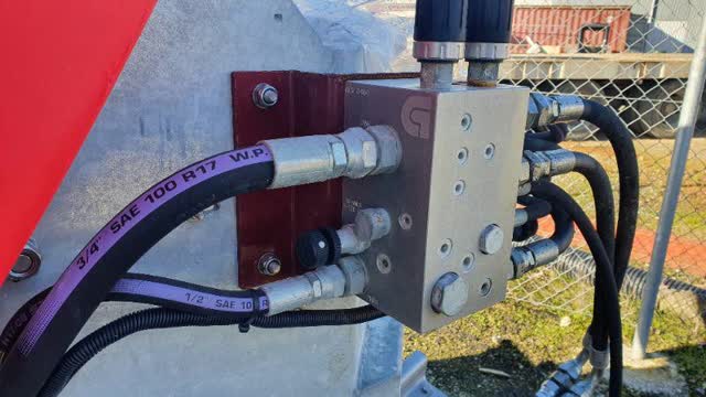 <p>Fit tractor hoses to valve and the floor drive cable.</p>
