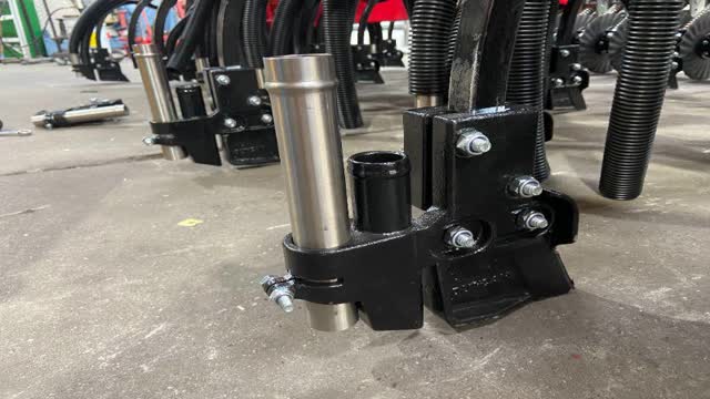 <p>With frame still lifted in air; place boot tine assembly onto coil tine. Line up to the white line for correct height and then tighten clamp bolts.</p>