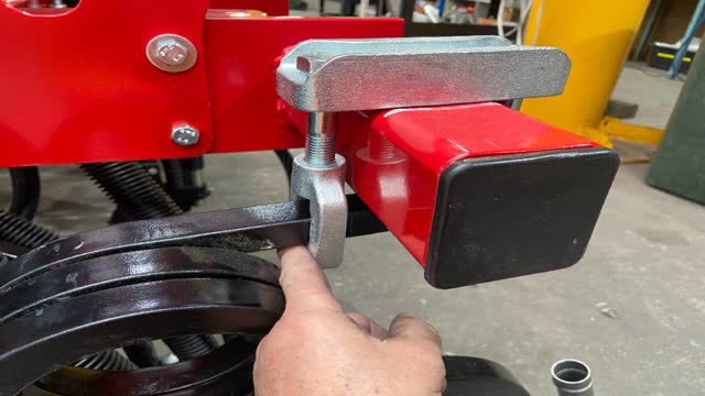 <p>Loosen and place clamp assembly over frame and insert coil tine through both clamps leaving about a finger gap between coil and clamp as per pic.</p>