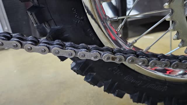<p>Check the chain tension is correct, 2 fingers movement only when a rider sit on the bike
Adjust the chain tension if its too tight or too loose</p>