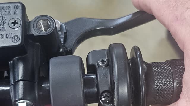 <p>Pull the right lever which engage the front brake
You shoukd feel good tension, push the bike forward to observe the brakes working well
If the lever goes all the way to the handle bar the brakes might not work fully
The front brake should get adjusted via the bleeding valve at the brake caliper</p>
