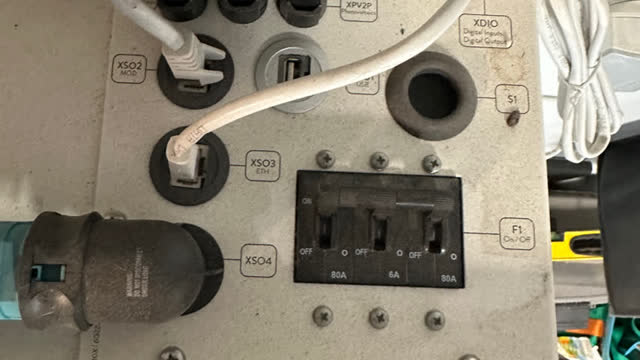 <p>This photo shows switches that are hard to see on top of the battery in the garage</p>
