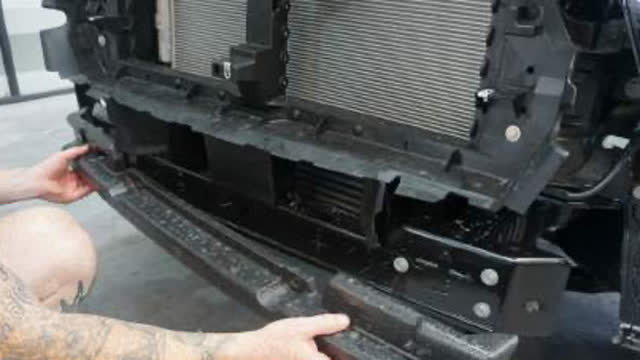 <p>Remove the factory bumper and bar foam.
Unbolt the three (3) bolts on each side
securing the bar reinforcement and place
aside for later use.</p>