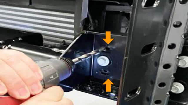 <p>On the Left Hand Side of the vehicle:
Drill the two (2) existing holes out to 10mm.
Deburr and paint.
Use the remaining cradle hardware through
these drilled holes and finger tighten only.</p>
