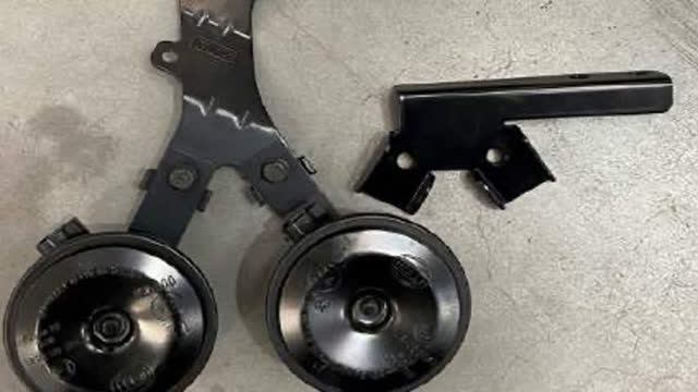 <p>Unbolt the factory bracket from the horn and discard.</p>